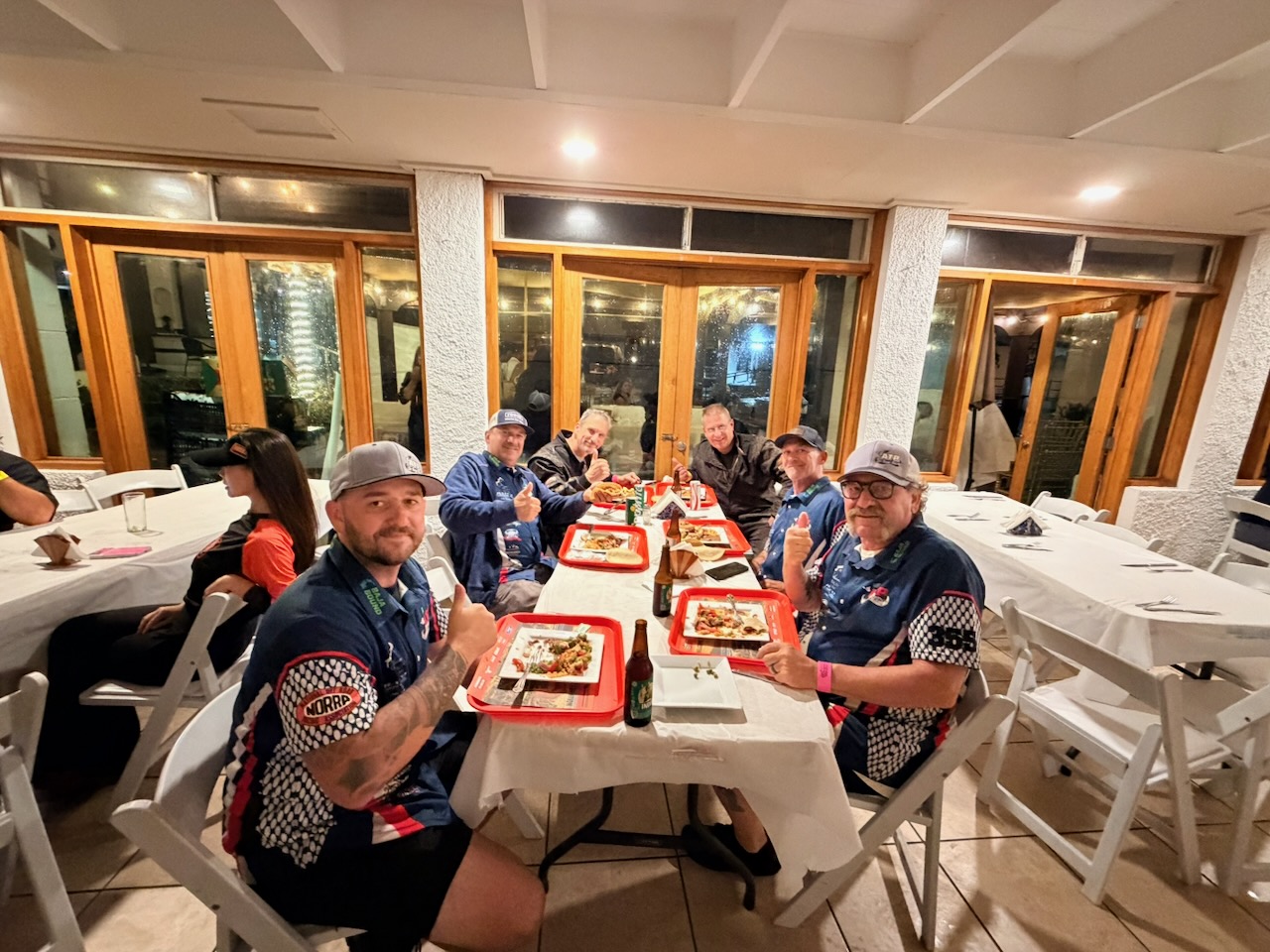 High Altitude Racing team celebrating over dinner after Race Day 2