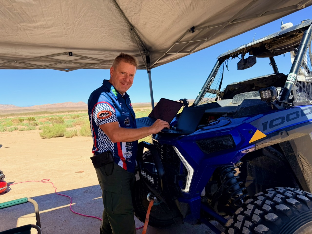 Team member analyzing ECU data at a laptop