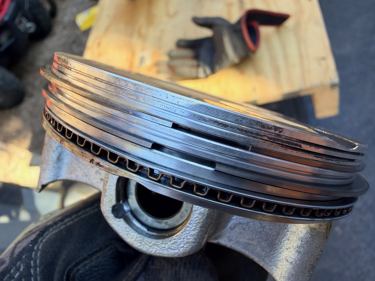 Close-up inspection of piston rings during assembly