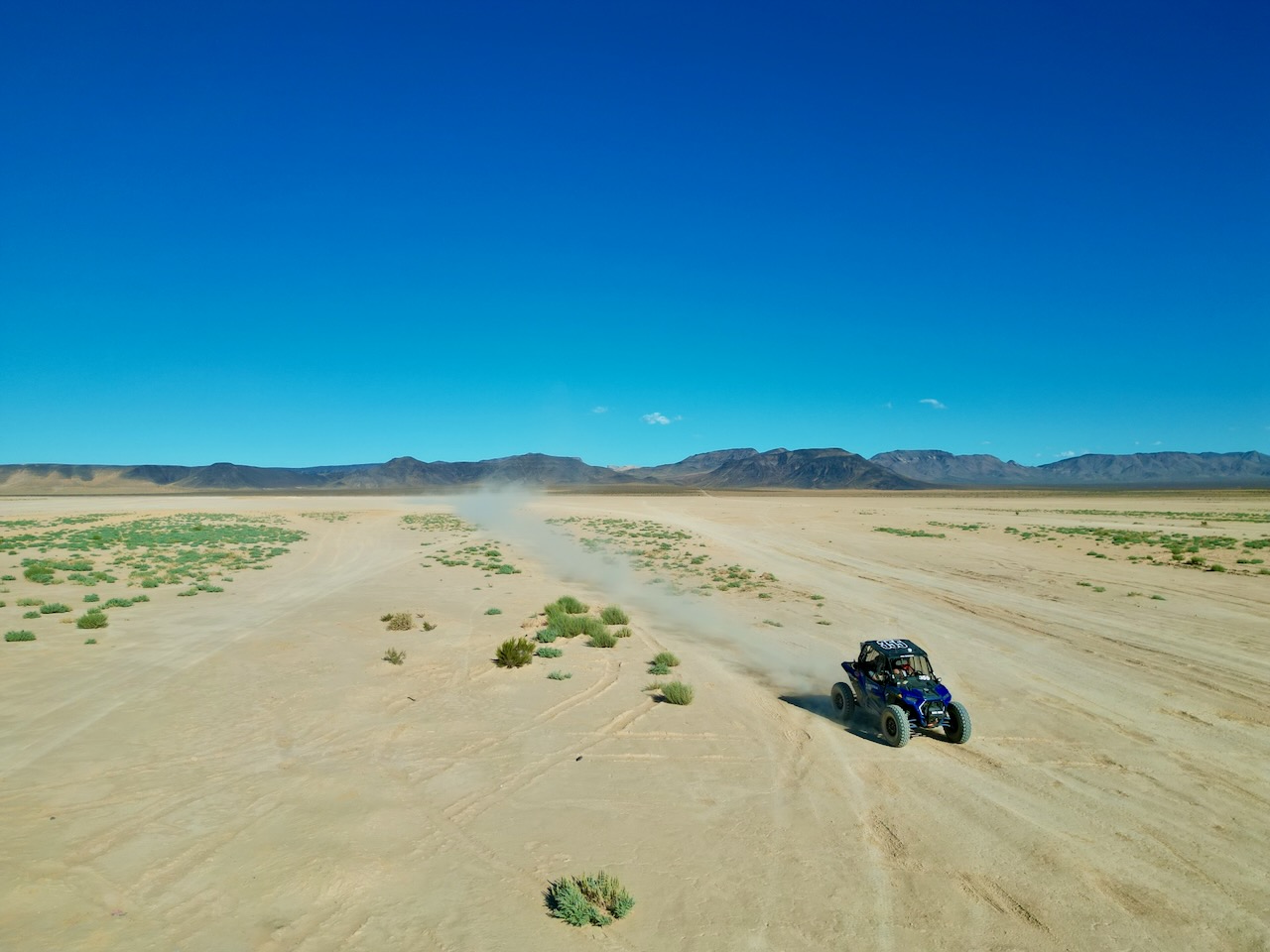 Race car crossing the Jean, Nevada dry lakebed during testing