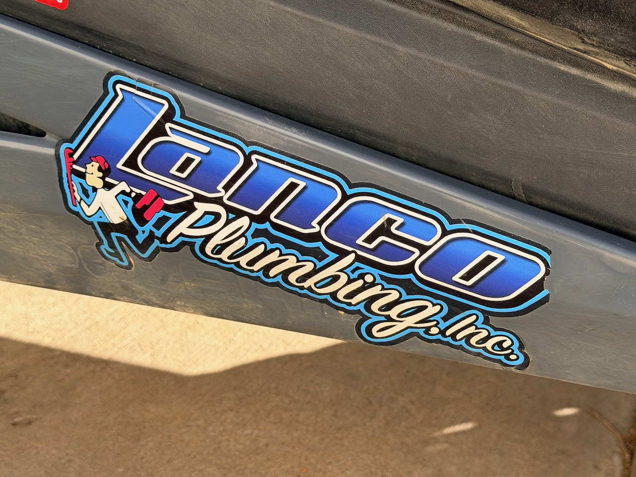 LanCo Plumbing sponsor sticker on race car 355
